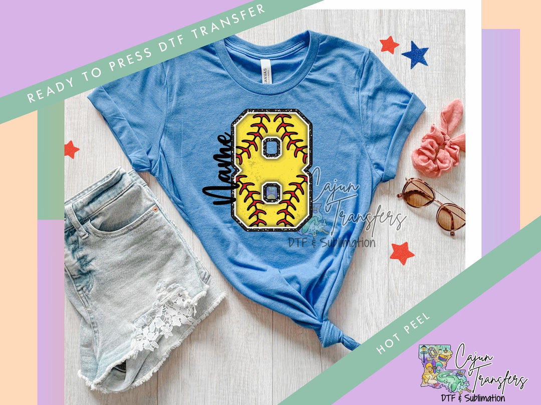 a t - shirt with a softball design on it