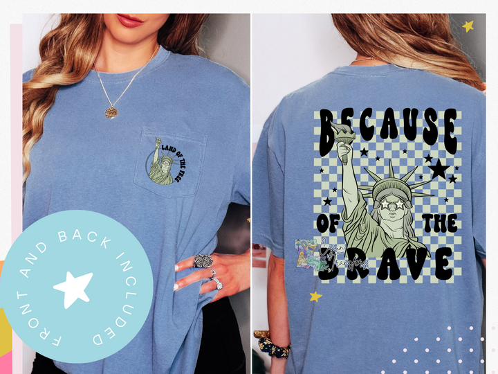 a woman wearing a blue tshirt with a picture of the statue of liberty