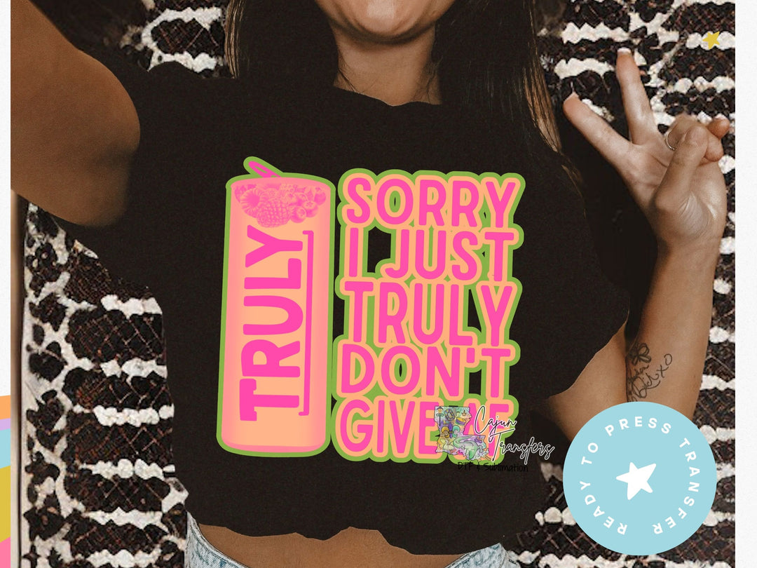 a woman wearing a t - shirt that says sorry just truly don't give