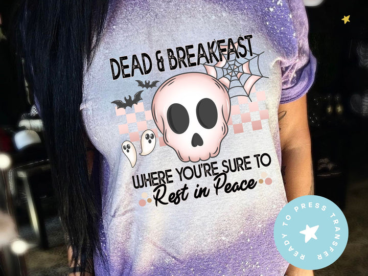 a woman wearing a purple shirt with a skull on it