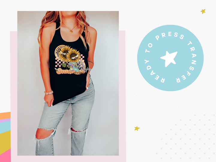 a woman wearing a tank top and ripped jeans