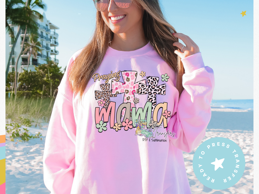 a woman wearing a pink sweatshirt with the word wild on it