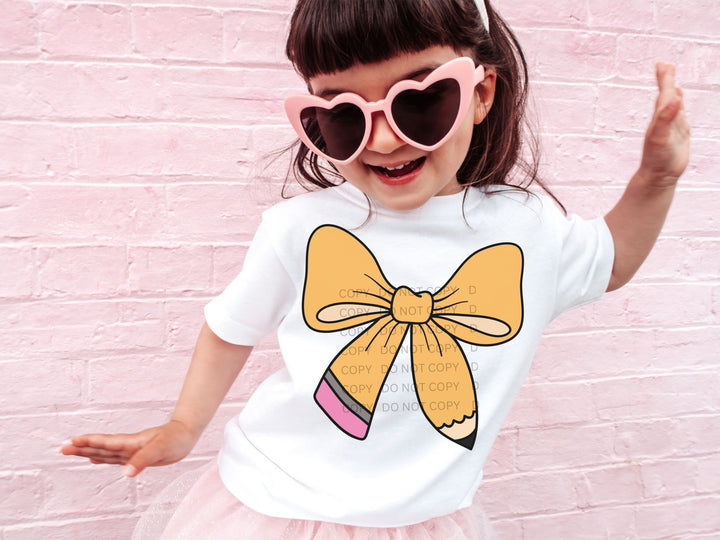 a little girl wearing pink sunglasses and a bow t - shirt