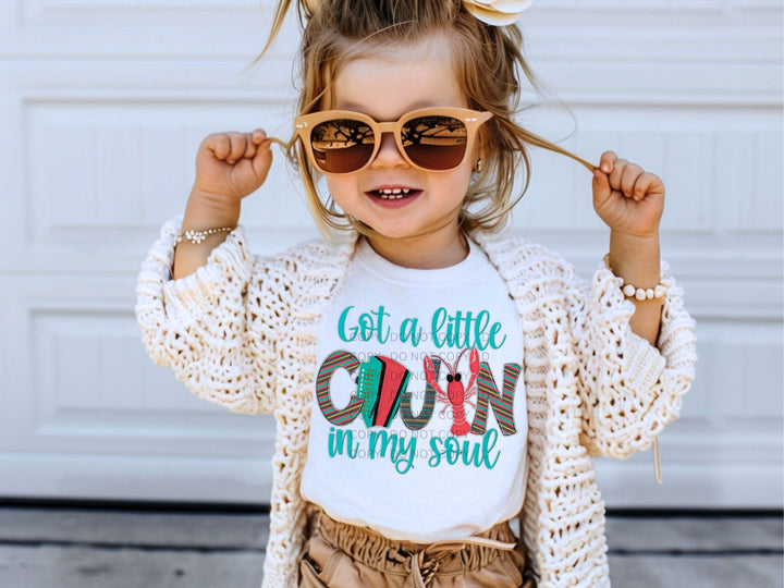 a little girl wearing sunglasses and a t - shirt