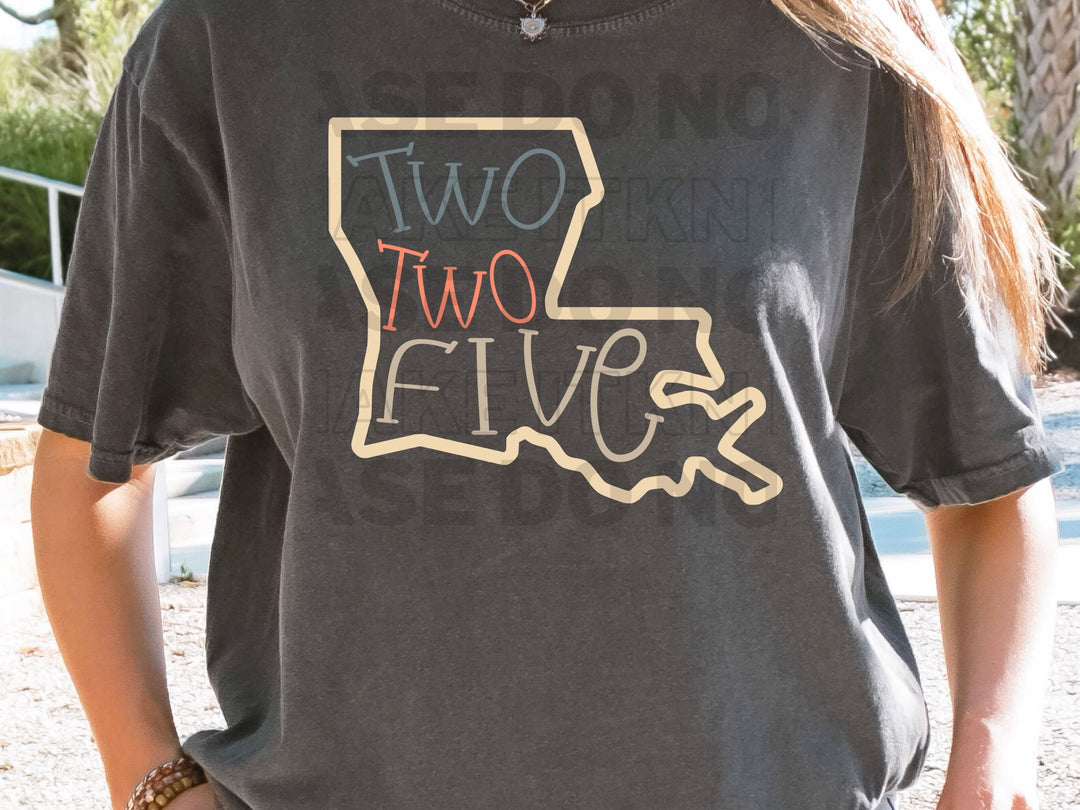 a woman wearing a t - shirt that says two two five