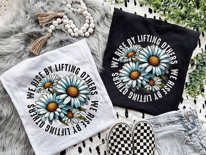 a pair of t - shirts with daisies on them