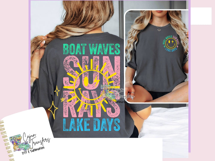 a woman wearing a boat waves sun rays lake days t - shirt